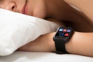 woman sleeping heart smart watch