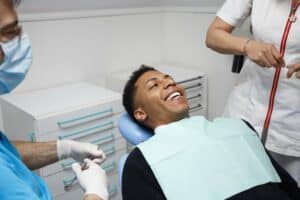 Happy patient preparing to undergo dental implant surgery