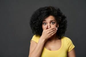 Woman looking shocked after losing a dental bridge in Bonita Springs