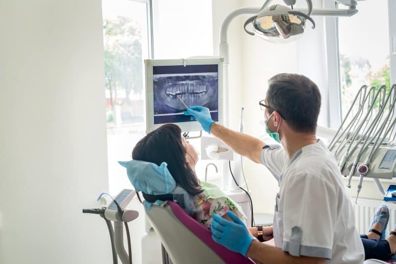 dentist discussing crown lengthening